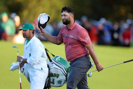 Jon Rahm of Spain reacts as he approaches the 18th green.
