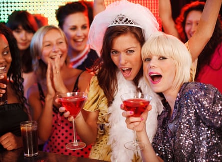 Two young women toasting at a hen night