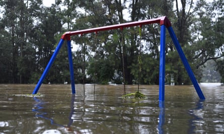 A semi-submerged children’s playground on the banks of the flooded Nepean River at Trench Reserve in Penrith.