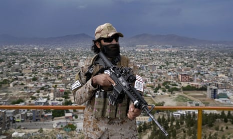 A Taliban special forces soldier stands guard at a park in Kabul,