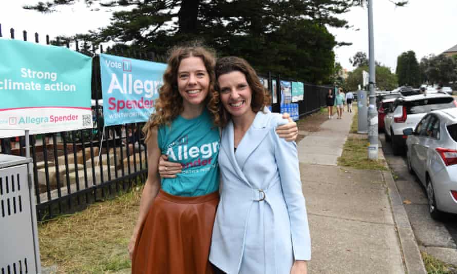 Allegra Spender (right) hugs her sister Bianca Spender outside Bondi Beach public school in the seat of Wentworth on Saturday morning.