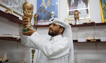 A dealer has a replica of the World Cup in the Souq Waqif market in Qatar.