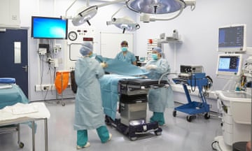 Preparing for surgery in an operating theatre in a hospital in the UK