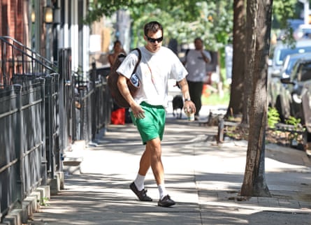 Harry Styles wearing short-shorts with sensible loafers.