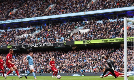 Julian Alvarez of Manchester City scores a goal to make it 1-1 against Liverpool at Etihad Stadium.