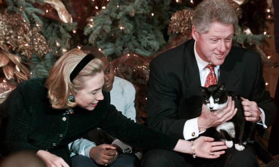 Hillary and Bill Clinton show off their cat socks.