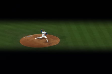 Shohei Ohtani of the Dodgers throws a pitch during the third inning.