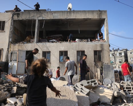 Palestinians inspect the damage at the site of an overnight Israeli strike on a school in Jabalia in the northern Gaza Strip on July 11, 2025.