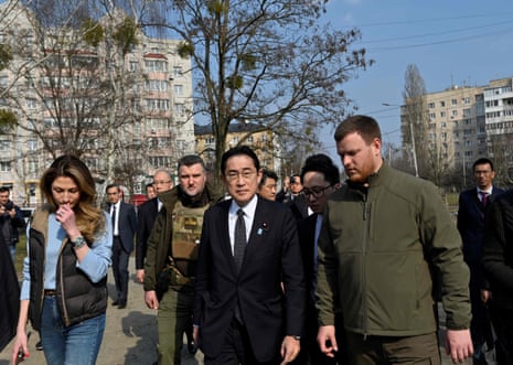 Japan's prime minister Fumio Kishida visits the site of a mass grave found on the grounds of the church of Saint Andrew Pervozvannoho All Saints in the town of Bucha.