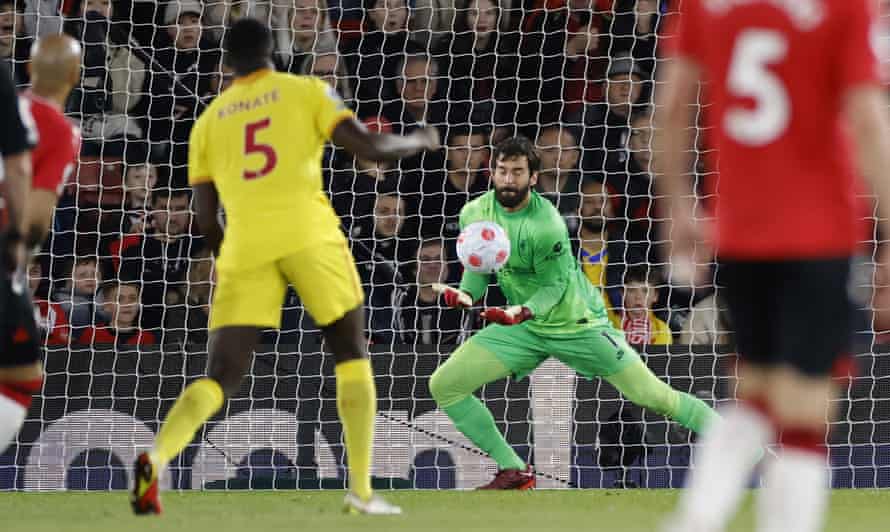 Alisson fumbles Redmond’s effort.
