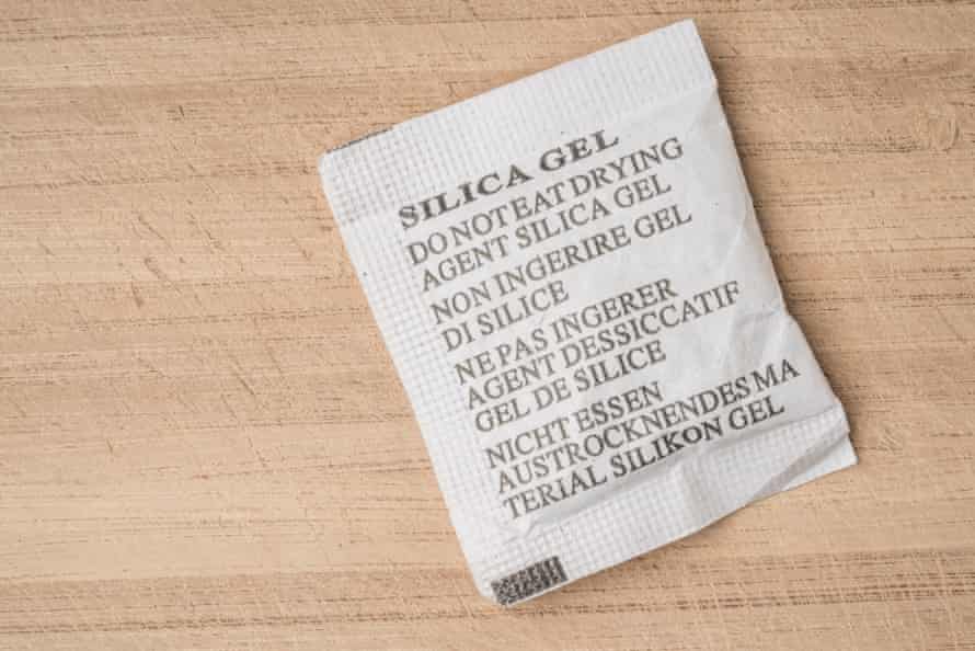 Desiccant or silica gel in white paper bag.