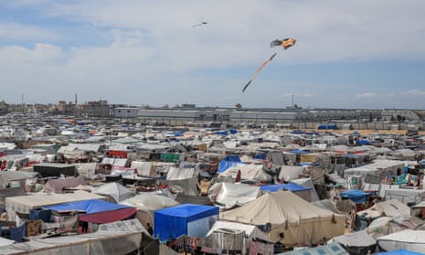 Makeshift tents set up near the border of Egypt as Israeli attacks continue in Gaza on 8 March. Several Palestinians claimed last week that after being granted Australian visas they had escaped Gaza and made it to an airport in Cairo, but were then told their visas were cancelled.