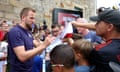 Harry Kane signs autographs for fans in Blankenhain outside England’s training base.