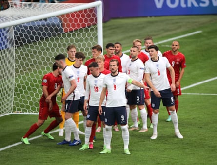 A congested England penalty area as the players wait for a corner.