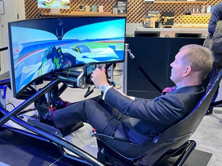 The trade minister Chris Bryant tries a racing simulation at Samsung in London to mark end of negotiations on new UK-South Korea deal.