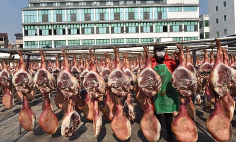 Hams hang to dry at Jinhua Jinnian Ham Co in Zhejiang province, China.