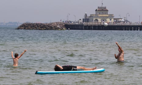 Beachgoers cool off at St Kilda beach in Melbourne. Extreme heatwave in Australia brought temperatures in mid-40s to northern Victoria, weather records broken elsewhere as heat forecast to continue