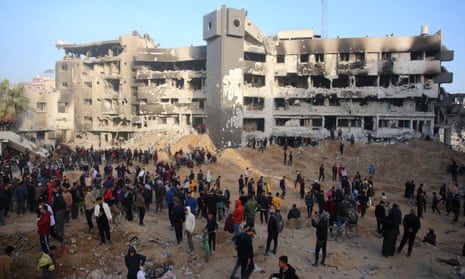 Palestinians inspect the damage at Gaza's al-Shifa hospital