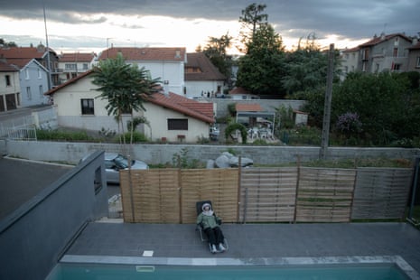 Nihal sits on chair outside