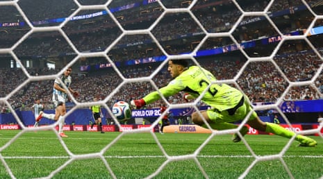 Egypt's keeper Mostafa Shoubir saves a shot on goal by Argentina's Julian Alvarez.