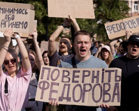 People protest against Ukrainian president Volodymyr Zelenskyy's decision to replace Mykhailo Fedorov as defence ministe, with the placard reading "Bring back Fedorov".