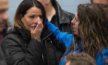 A union member cries before a press conference with union leaders in Oshawa, Ontario on 26 November.