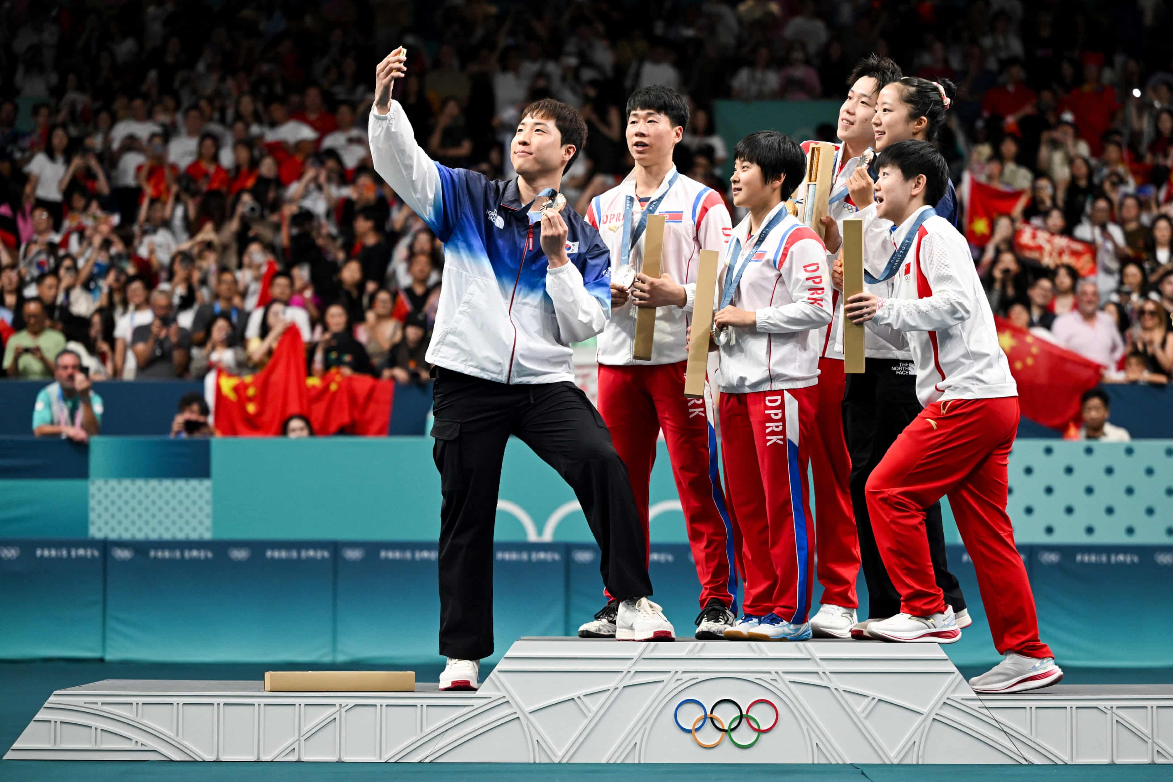 North Korean table tennis players may be punished for Olympic podium selfie with rivals from South (theguardian.com)
