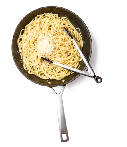 Adding the drained pasta plus a splash of its cooking water to butter pan. Toss together well vigorously until well coated, then add most of the grated cheese and keep stirring until well combined, adding a little more pasta water if necessary.