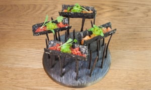 Tuna and salmon tacos perched on top of twigs