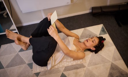 Varma on her back on a spiky mat reading Macbeth’s letter to Lady Macbeth