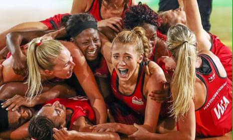 Helen Housby, centre, celebrates with her Engladn teammates after winning the Netball gold medal match between England and Australia on day 11 of the Commonwealth Games.