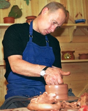 August 2001: Putin makes a clay pot during his visit to an open air museum in the village of Verkhniye Mondrogi