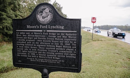 The historical marker sign at the roadside near the site of the Moore’s Ford Bridge lynching.