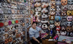 A Chinese trader waits for customers at her stall