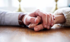 Man and woman holding each other’s hands