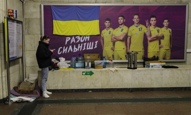 A poster featuring Ukrainian national-team players reads “We are stronger together” in a Kyiv metro station that also serves as a bomb shelter.