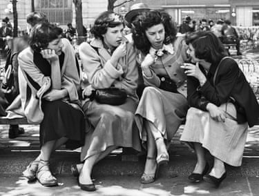 women talking to each other on a bench