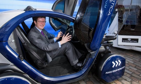 Business secretary Greg Clark in a self-driving pod