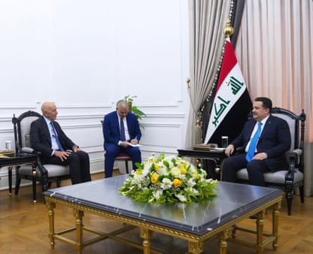 Iraq’s former PM Mohammed Shia al-Sudani and the US envoy, Tom Barrack, sitting on chairs during a meeting with one other person