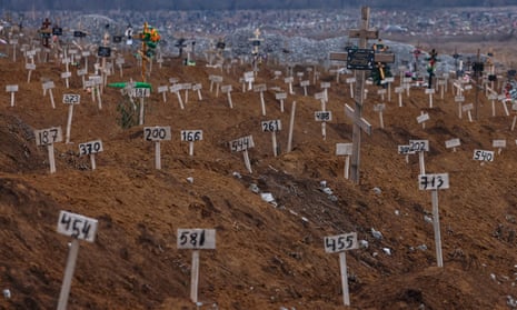 In a cemetery in Mariupol, numbers mark the graves of unidentified residents killed during fighting in the city.