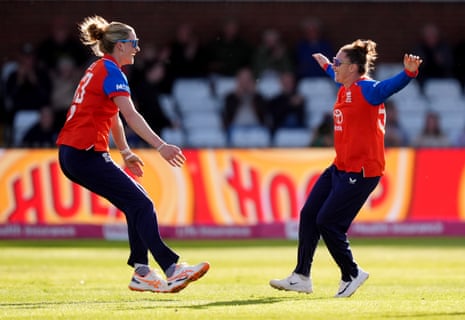 England's Lauren Bell (left) celebrates catching out New Zealand's Melie Kerr with teammate Linsey Smith.