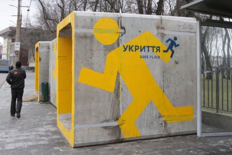 A man walks past a concrete bomb shelter in Dnipro.