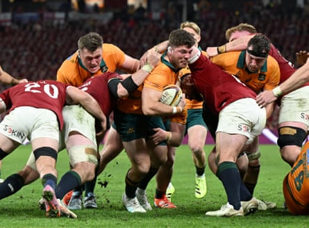 Australia’s Carlo Tizzano carries the ball forward during the first Test against the Lions