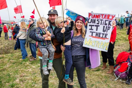 A family with two young sons at a beach protest at Gwithian in north Cornwall.