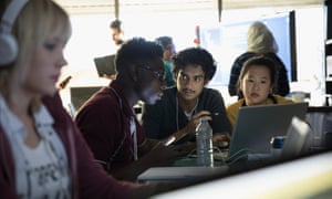 Hacker team working hackathon at laptop in dark office