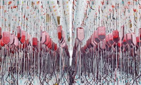 Rows of donated human blood hang from hooks as they undergo processing at a blood centre.