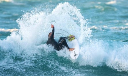 Sam Smart, co-owner of Smart surf school, surfing in Cornwall during the second lockdown.
