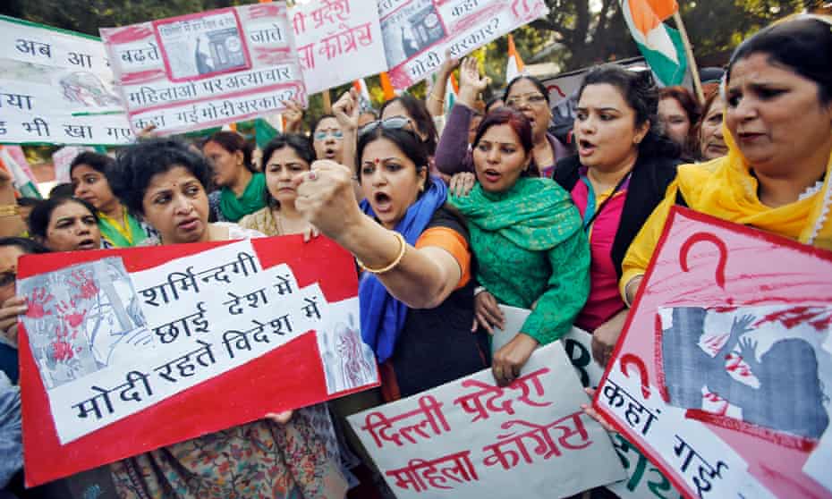 Members of All India Mahila Congress protest the rape of a passenger by her driver in New Delhi in 2014. The case prompted India to temporarily ban Uber in the capital. 