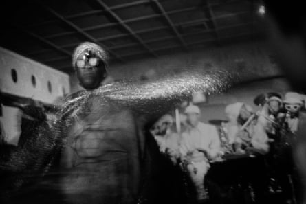 Sun Ra in silver cape, hat and sunglasses