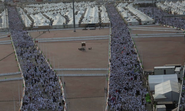 Pilgrims walk from their tents in Mecca